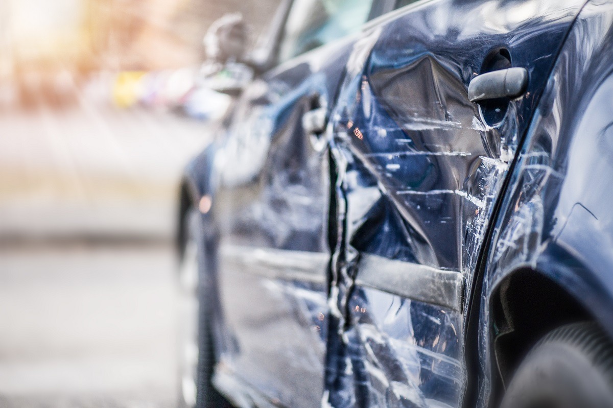 Damage side or door after collision in city