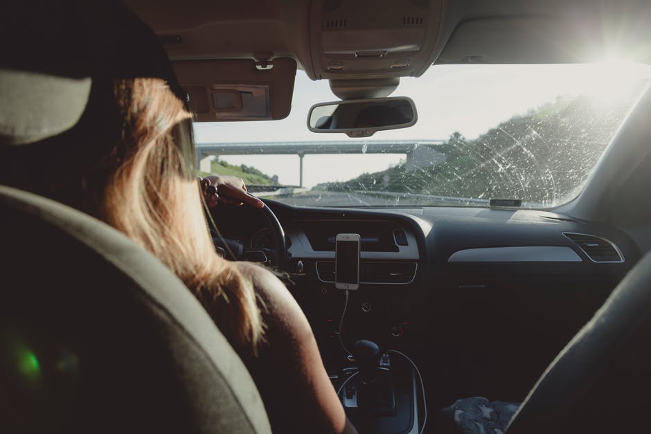 woman driving car on freeway