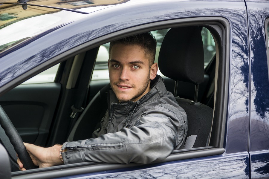 Young man driving car
