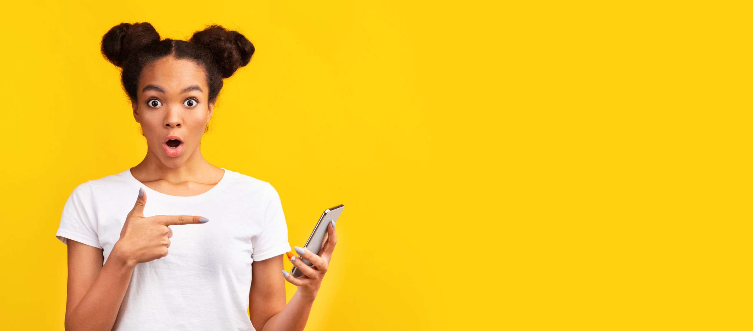 black teen pointing at cell phone