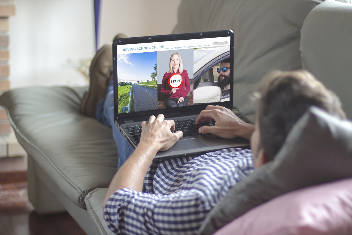 man on the sofa using laptop