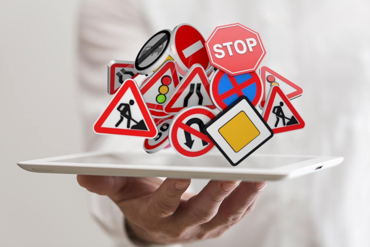 Man holding traffic signs