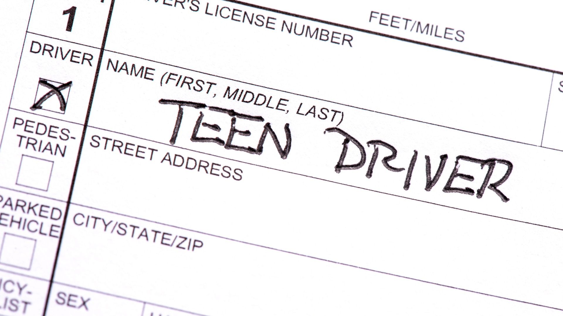 A close up collision report with the words "Teen Driver" on it.