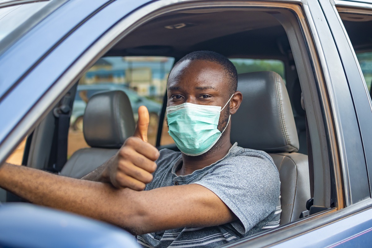 african driver wearing a face mask