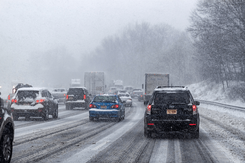 cars on a snowy motorway