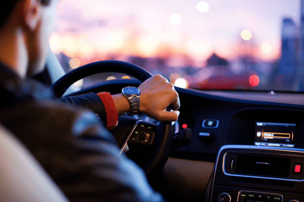 man driving his modern car at night