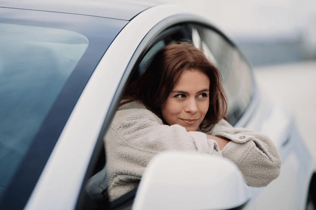 beautiful woman in a car