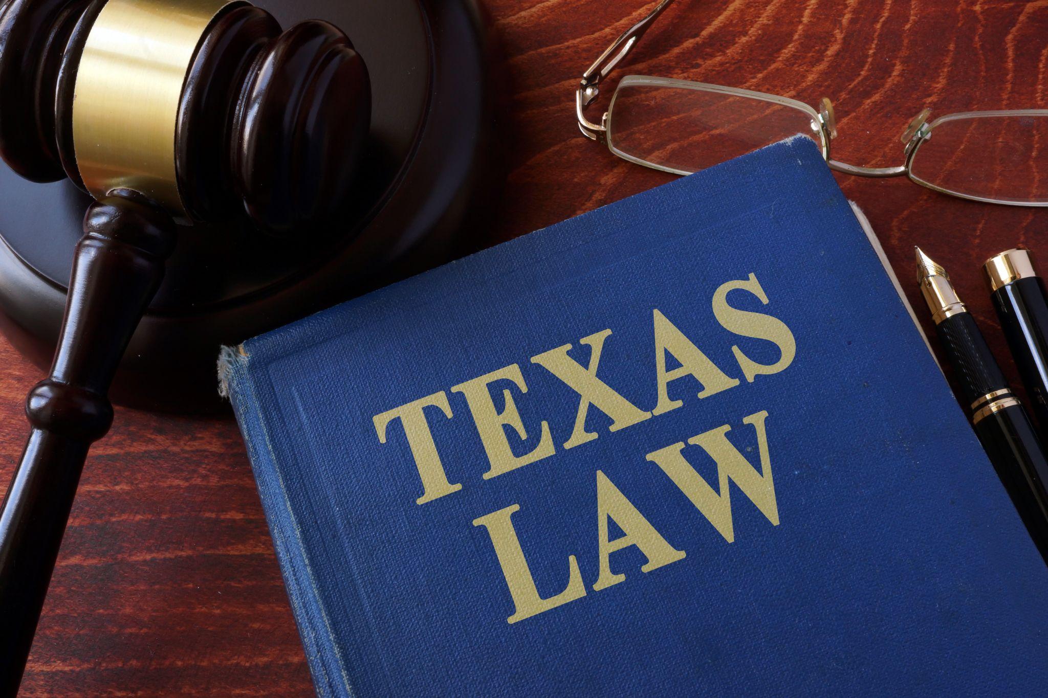 Book with title Texas law and a gavel.