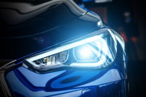 Macro view of modern blue car xenon lamp headlight in Texas