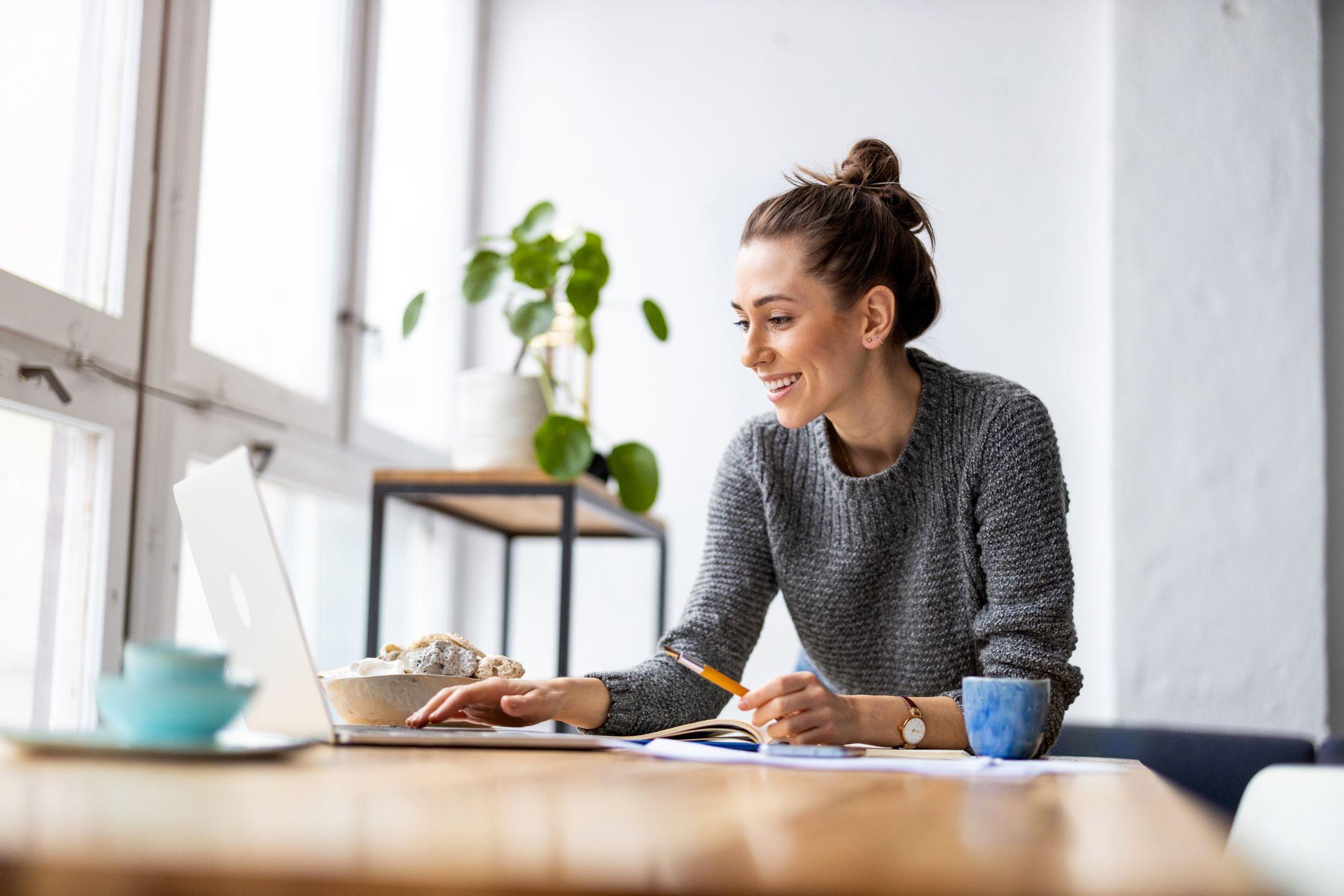 Creative young woman working on laptop